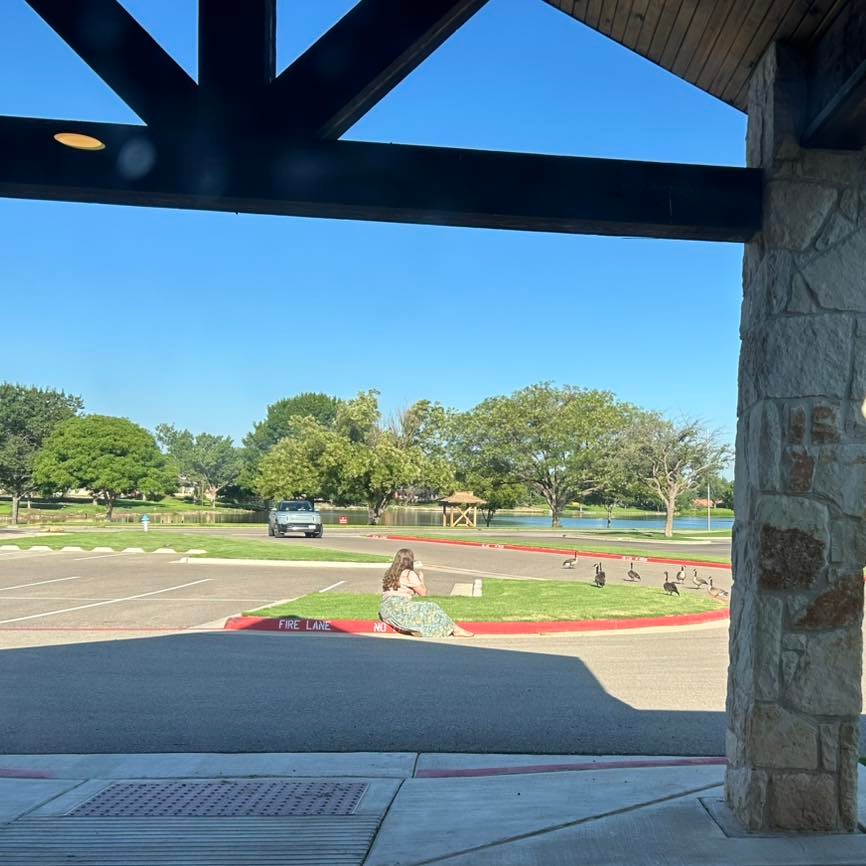Mirth the goat feeding blueberries to visitors at Heartbeat Midwifery